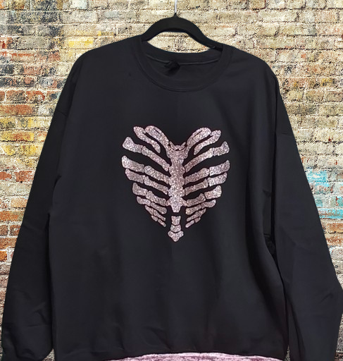Heart shaped skeleton with middle fingers